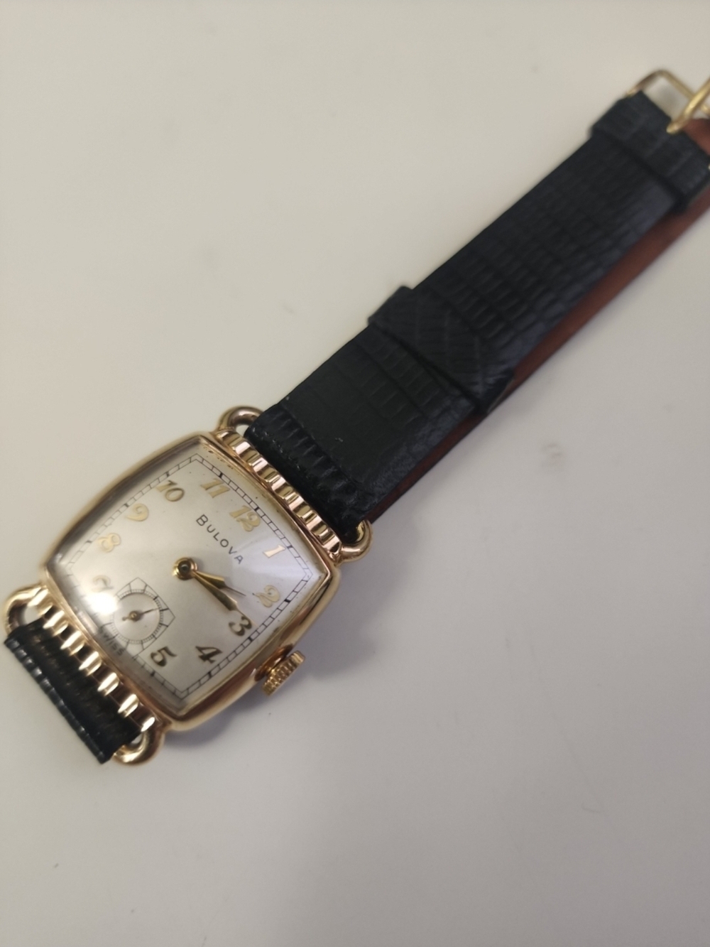 Vintage Bulova Gold Case Watch with Black Strap and Ivory Dial